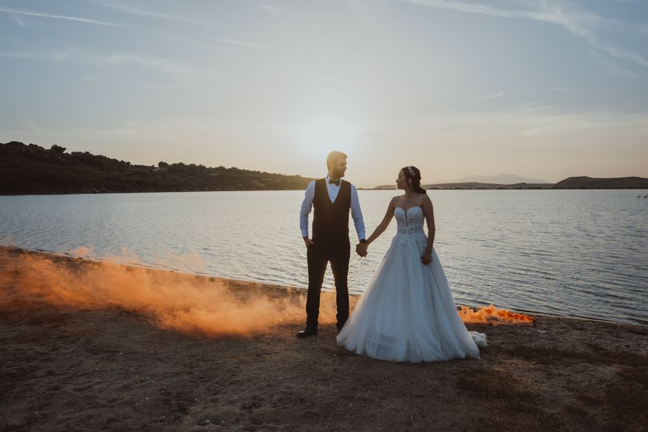 A couple sharing a romantic moment at sunset, representing the emotion of a wedding film